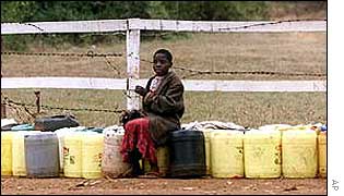 Kenyan child with water containers   AP