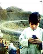 Afghan boy holding pet bird   AP