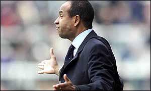 Fulham manager Jean Tigana looks upset