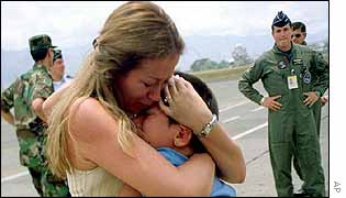 Mother embraces son whose father and grandfather are among the abducted  