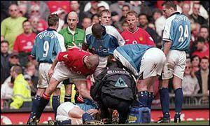 Roy Keane stands over Alf Inge Haaland