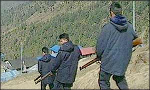 Nepalese policemen patrol hill country
