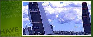 GBR Challenge (left) and Team NZ (right) sail in Auckland during a warm-up regatta