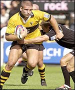 Wasps' Joe Worsley is tackled by Jonny Wilkinson.