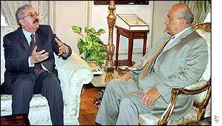 Iraqi Foreign Minister Naji Sabri (left) talks to his Egyptian counterpart Ahmed Maher  in Cairo on Tuesday