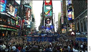 A crowded Times Square watches Bon Jovi