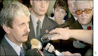 The SDKU's leader, Mikulas Dzurinda (left), speaks shortly after exit polls are announced