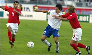 Ryan Giggs and Robbie Savage put Finland captain Jari Litmanen under pressure