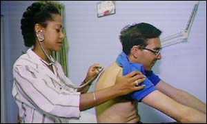 GP examines patient