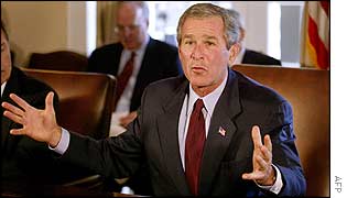 President Bush holds hands apart   AFP