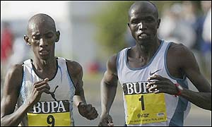 Tanzania's John Yuda and Kenyan Paul Kosgei  were close together until the last 400 metres