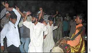 Religious Parties Alliance supporters celebrate an unofficial good result in Islamabad