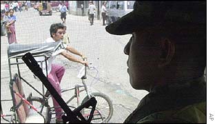 A Philippine Marine soldier keeps a tight watch from his post in  Zamboanga