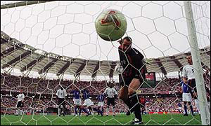 David Seaman watches Ronaldinho's free-kick sail over his head in England's World Cup quarter final defeat  to Brazil