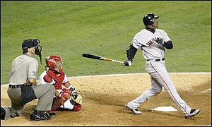 Barry Bonds of the San Francisco Giants hits a home run in the sixth inning giving the Giants a 4-0 lead - Kenny Lofton scores in  the following inning to make it 5-0