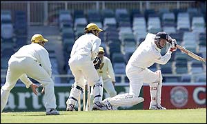 John Crawley slips the ball past the Western Australian fielders