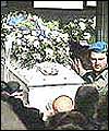 A coffin is carried