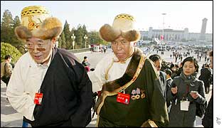 Two Tibetan delegates walk up the steps of Beijing's Great Hall of the People as they arrive for the opening session of the 16th  Chinese Communist Party Congress 8 Nov 2002.  