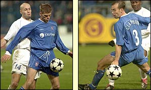 Ipswich's Icelandic colossus Herman Hreidarsson  holds up the ball while midfielder Jamie Clapham  tracks back