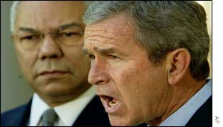 Colin Powell and George  Bush