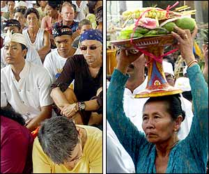 Foreign tourists sit with local residents during the ceremony (AFP photo); Balinese women carry oblation  (AP photo)