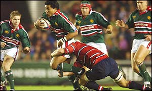 Leicester's Freddie Tuilagi is tackled by Gloucester's Jake Boer