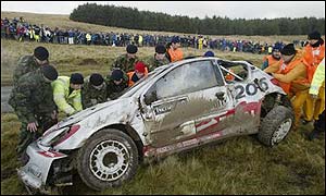 Gronholm rolls his Peugeot on stage ten to leave the field wide open