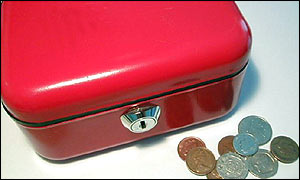 A moneybox and money