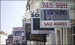 A row of for sale signs