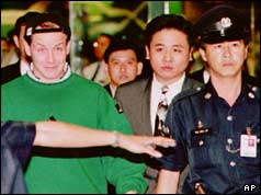 Nick Leeson with police in Singapore