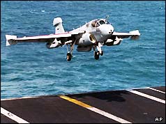 An EA-6B Prowler lands aboard the aircraft carrier USS Nimitz  in the Persian Gulf , Jan 1998 