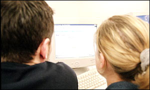 Man and woman on PC