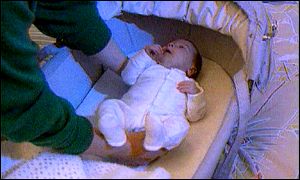 Baby in cot