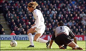 Jerzy Dudek looks back in horror as Diego Forlan scores