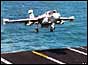 An EA-6B Prowler lands on the aircraft carrier USS Nimitz  in the Persian Gulf , Jan 1998 
