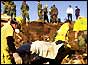 Victim's body being carried away