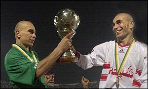 Ibrahim and Hossam Hassan with the trophy