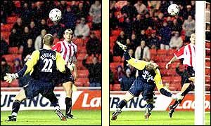 Gavin McCann loops the ball over Liverpool goalkeeper Chris Kirkland to give Sunderland a 1-0 lead after 36 minutes