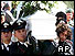 Italian police carry coffin of one of the quake victims