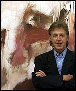 Sir Paul McCartney with one of his paintings