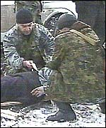 A casualty of the Grozny bombing lies on a makeshift stretcher. Picture: TVS television  channel