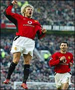 David Beckham celebrates his goal against Portsmouth