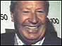 Former Prime Minister Edward Heath celebrates the result