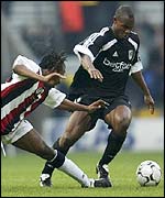 Fulham's Martin Djetou skips past Ricardo Gardner