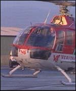 Helicopter carrying slate arriving in Cardiff 