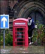 Phonebox in floods   PA