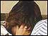 Woman covering her face with her hands