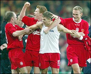 Gerrard is mobbed by his team-mates after his goal 