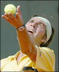 Argentina's Sergio Roitman serves to defending champion Alberto Costa