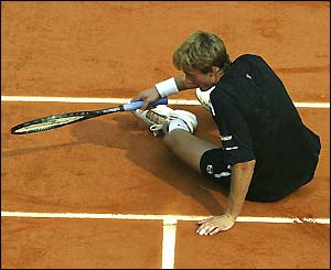 Juan Carlos Ferrero looks  upset as he as he loses the first set 6-4